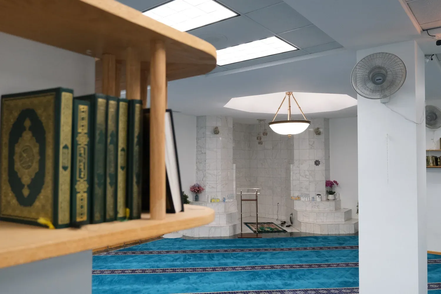 The DIC prayer hall with Qur'an shelves